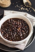Black chickpea soup with sesame seeds