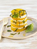 A vegan tomato tower with pecan nut and macadamia nut cheese and basil