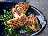 Stuffed turkey escalopes on a bed of leaf spinach