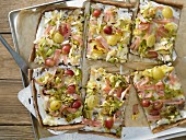 Pointed cabbage tarte flambée with turkey breast and grapes