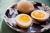 Marinated boiled eggs as a topping for Japanese ramen soup