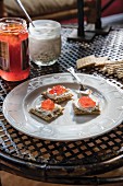 Crackers with home-made cream cheese, honey and jam