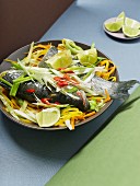 Steamed loup de mer with vegetables and lime