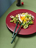 Wok-fried cabbage with a fried egg