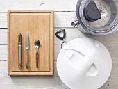 Kitchen utensils: a juicer, salad spinner, peeler, knife and spoon