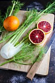Blood oranges and fennel on a wooden board