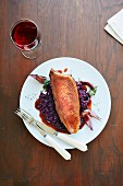 Roast breast of goose on a bed of red cabbage