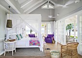Canopy bed in bedroom of summery beach house