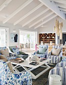 Armchairs with various upholstery in living room of beach house