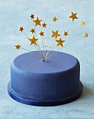 A blue party cake with star decorations