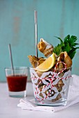 Whelks in a glass with lemon, parsley and New England seafood salsa