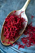 Persian saffron threads on an antique spoon (close-up)