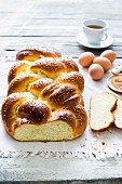 Challah (a Jewish sweet bread plait) with ingredients and coffee