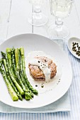 Fillet of pork with creamy green pepper sauce and asparagus