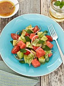 A summer salad with cucumber, tomato and watermelon
