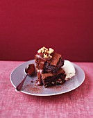 Brownies with chocolate sauce and walnuts