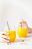 Mango and pineapple smoothies with turmeric