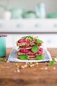 Tofu spread with baked beetroot and sprouts