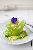 A base of steam celery with celery and sweetcorn salad, served with two sauces