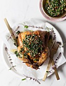 Roast chicken with lemon, herbs ans hand-chopped kale and almond pesto
