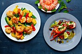 Three crustacean dishes: prawns with fruit, a ring of prawns amd lobster