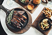 Marinated beef ribs and calamari rings at the Potato Shed restaurant (Johannesburg, South Africa)
