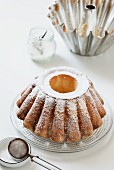 A freshly baked Bundt cake dusted with icing sugar