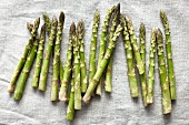 Green asparagus on a linen cloth