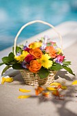 Bouquet of spring flowers in wicker basket