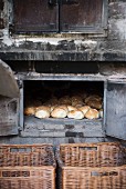 Freshly baked bread rolls in a wood-fired oven