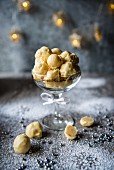 White chocolate and orange truffles in a stemmed glass for Christmas