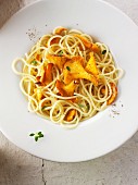Spaghetti with chanterelle mushrooms sautéed in butter and herbs