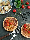 Three cheese tarts with cherry tomatoes and potatoes