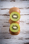 Kiwi fruits, whole and halved