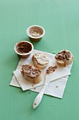 Vegan almond and coconut-almond spreads on bread and in tubs
