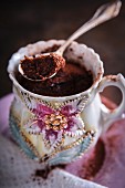 Small chocolate mug cake in a vintage cup