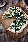 Pizza bianca with spinach and pesto