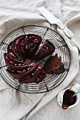 Slices of chocolate Bundt cake garnished with pomegranate seeds