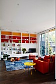 Living room with colored shelves and colorful furniture