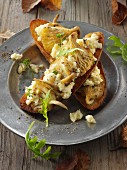 Yellow oyster mushrooms sauteed in butter and served with scrambled egg on sourdough toast with wild rocket