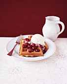 Waffles with cherries and vanilla ice cream