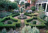 Classic Formal Patio with Boxwood Hedge