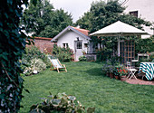 Garden with seating area and garden house