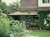 House with ivy and pot place
