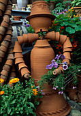 Woman figure made of clay pots