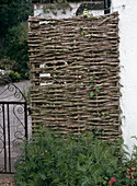Screen wall made of woven branches
