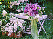 Spring scent: Syringa (white lilac) in a basket, bouquet of lilacs