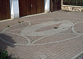 Ornamental paving with coloured concrete paving stones