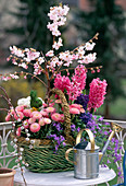 Basket with Campanula, Hyacinthus, Bellis, Prunus