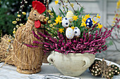 Easter arrangement with straw hen and cut eggs